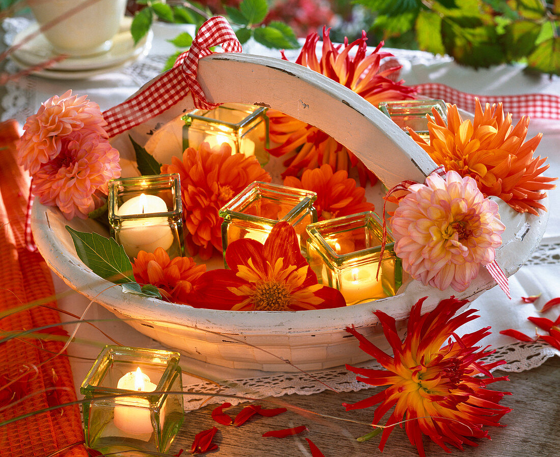 Various flowers of dahlia and square lanterns in basket