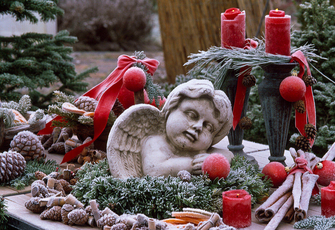 Angel in wreath of Abies, Buxus, candle holder with Pinus