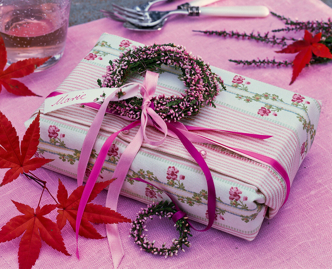 Book gift wrapped in cloth with garland from Calluna