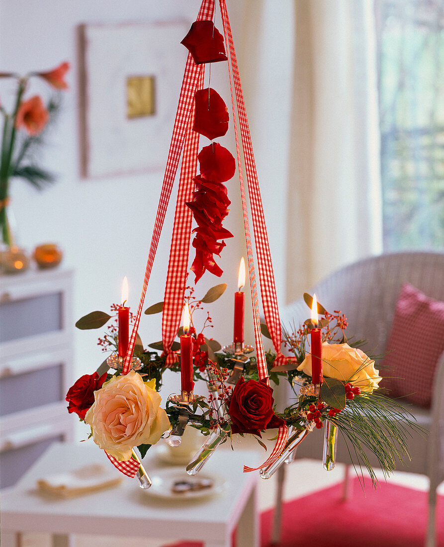 Hanging Advent wreath made of metal ring with candle holders