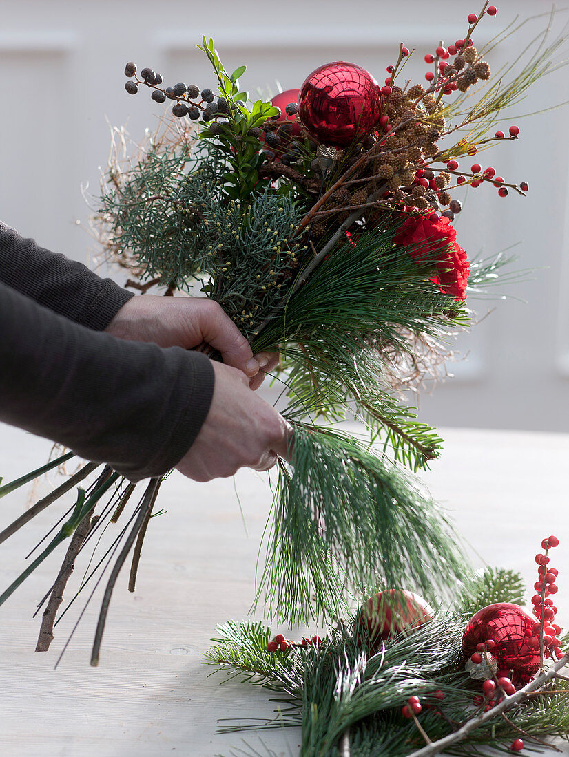 Bouquet with red carnations and Christmas tree balls (2/3)