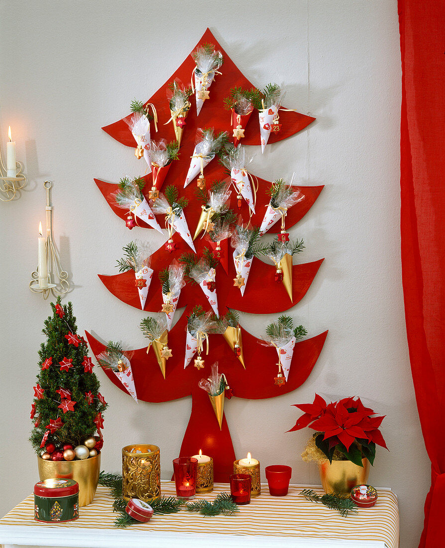 Advent calendar in the shape of a Christmas tree with small pointed bags