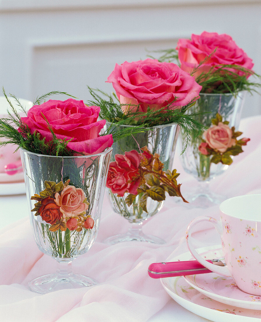 Pink (roses), Asparagus (ornamental asparagus) in small glasses with wafers
