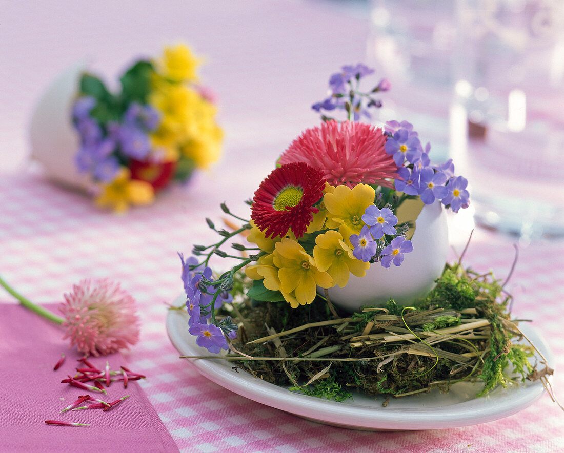 Eggshells as vases on moss