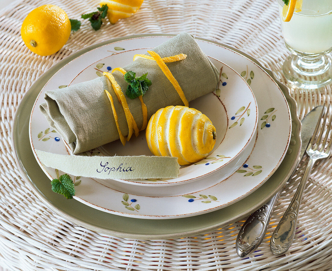 Citrus (lemon) with carved pattern, bowl as napkin ring