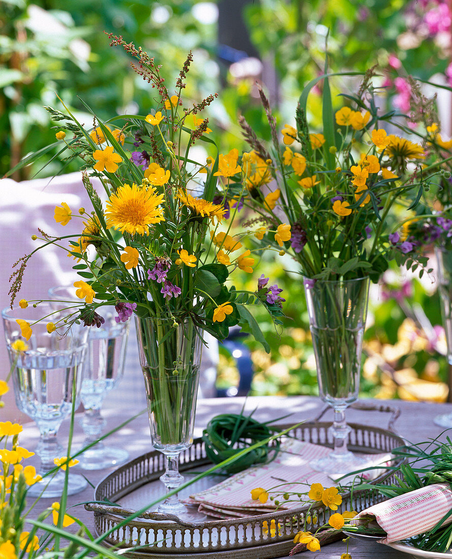 Meadow bouquets from Taraxacum, Ranunculus, Rumex