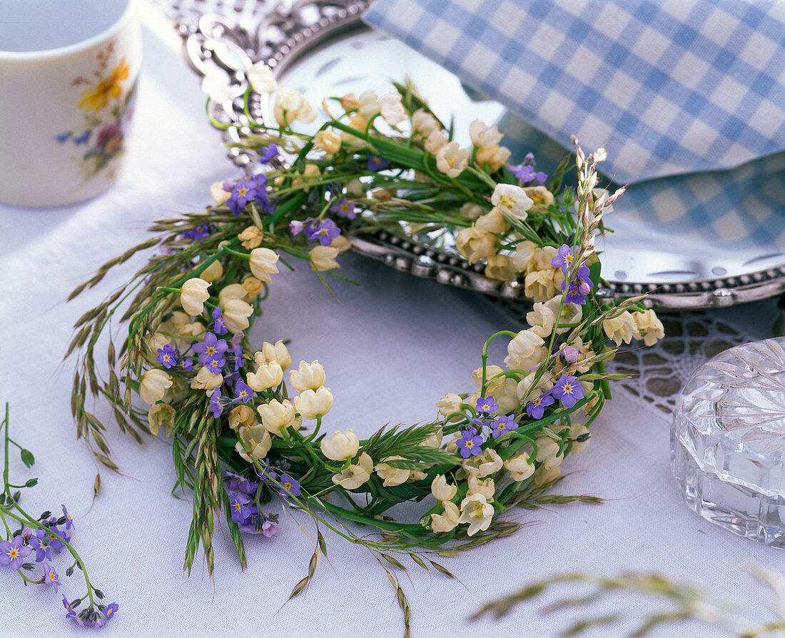 Wreath of Convallaria (lily of the valley), Myosotis (forget-me-not) and grasses