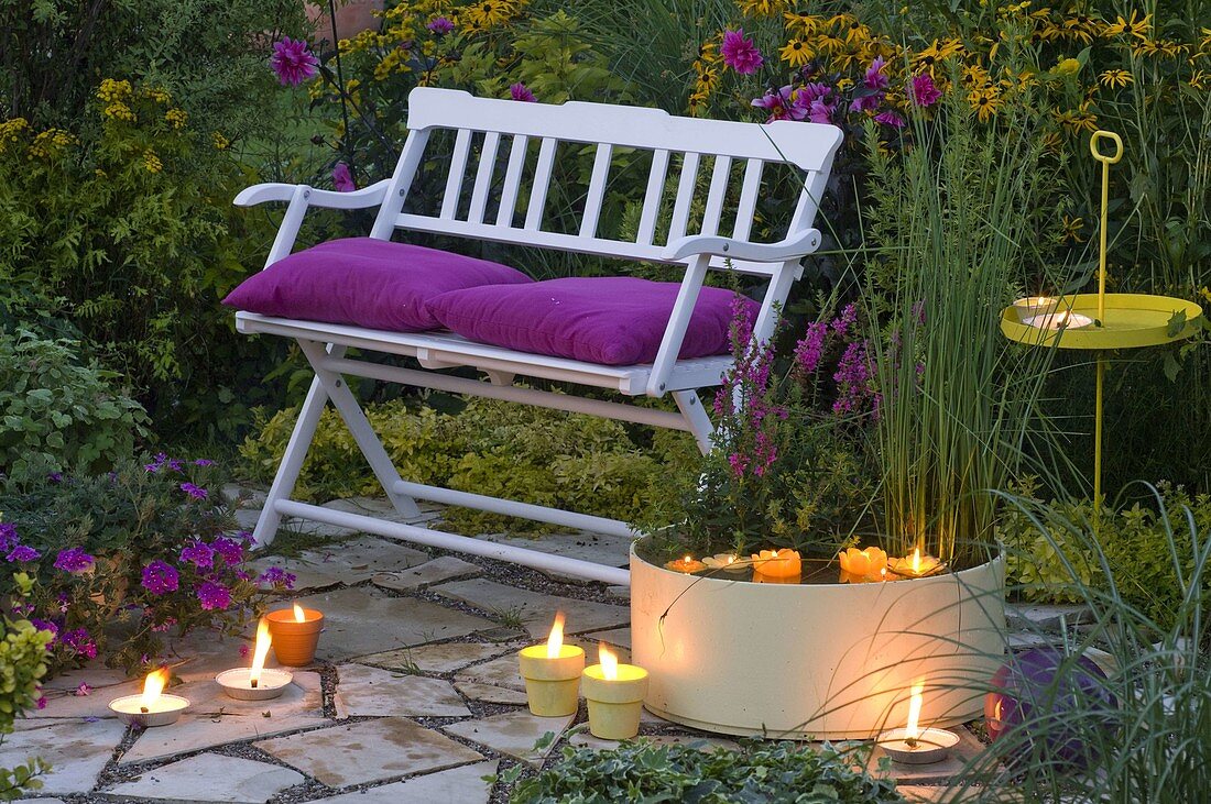 Evening seating area with white bench