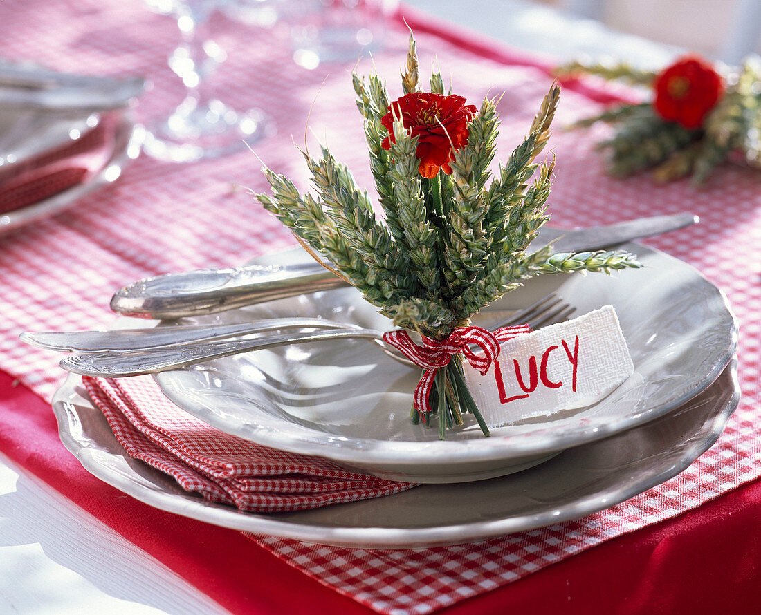 Table decoration with wheat and zinnias