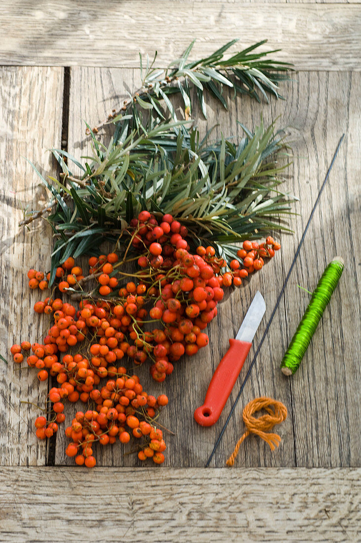 Wreath made of sea buckthorn and rowanberries