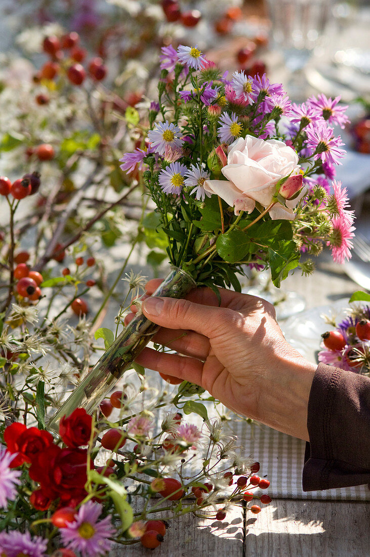 Table decoration with asters and roses