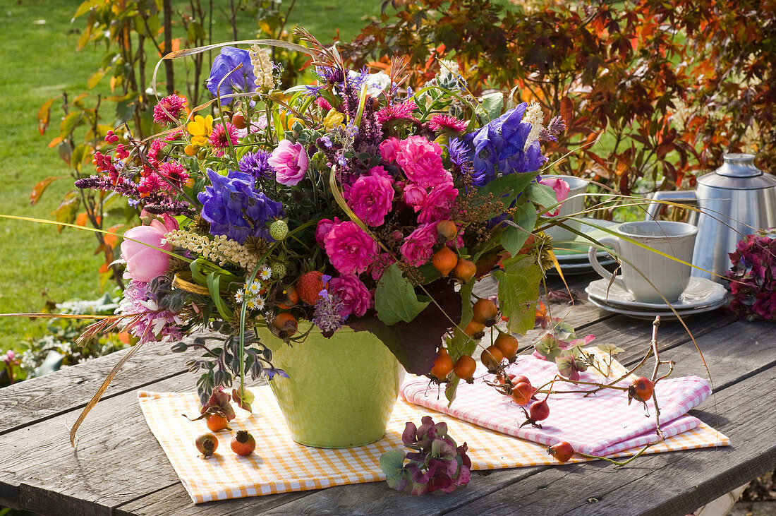 Autumn bouquet with pink (roses, rose hips), Aconitum (aconite)