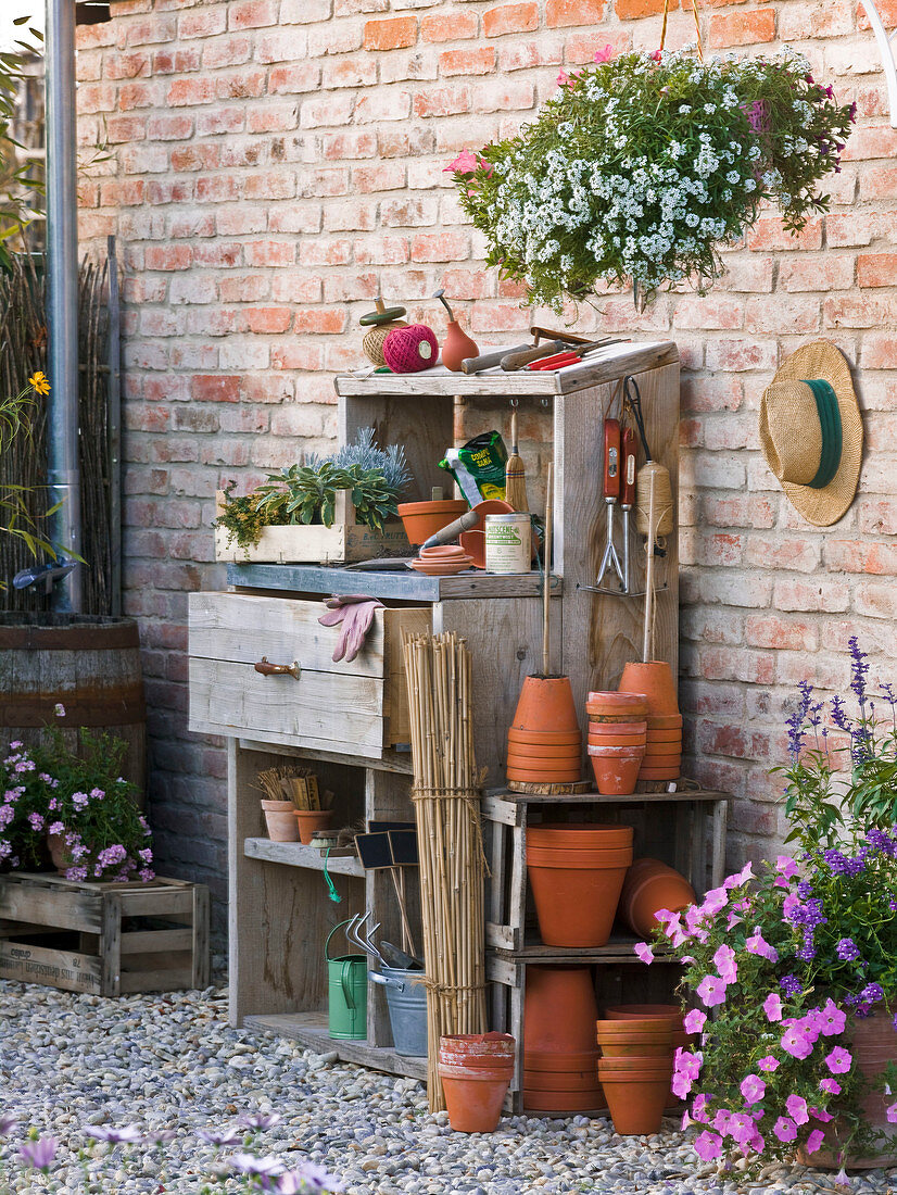 Work style worktable with clay pots, bamboo poles, planting utensils