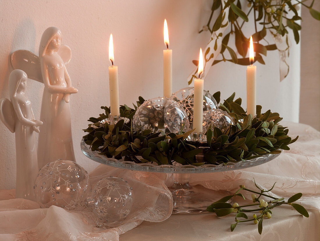Advent wreath made of Viscum album (mistletoe) with white candles