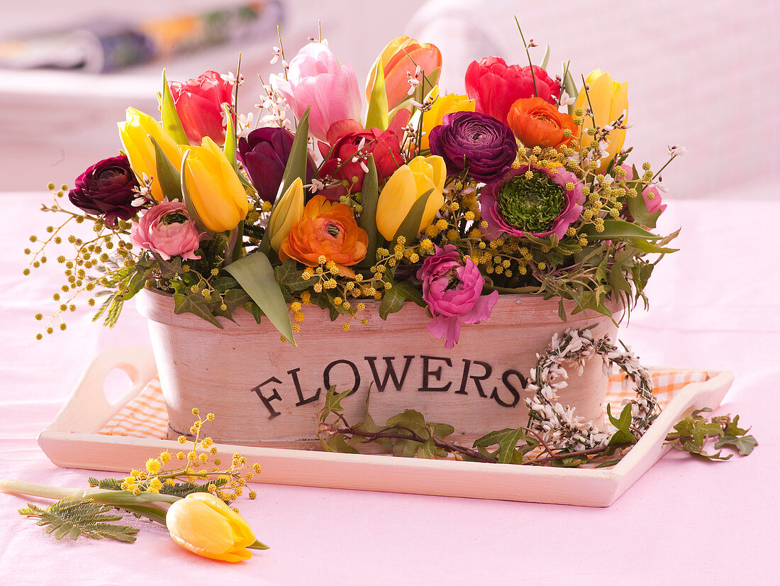 Colorful spring arrangement of tulipa, ranunculus