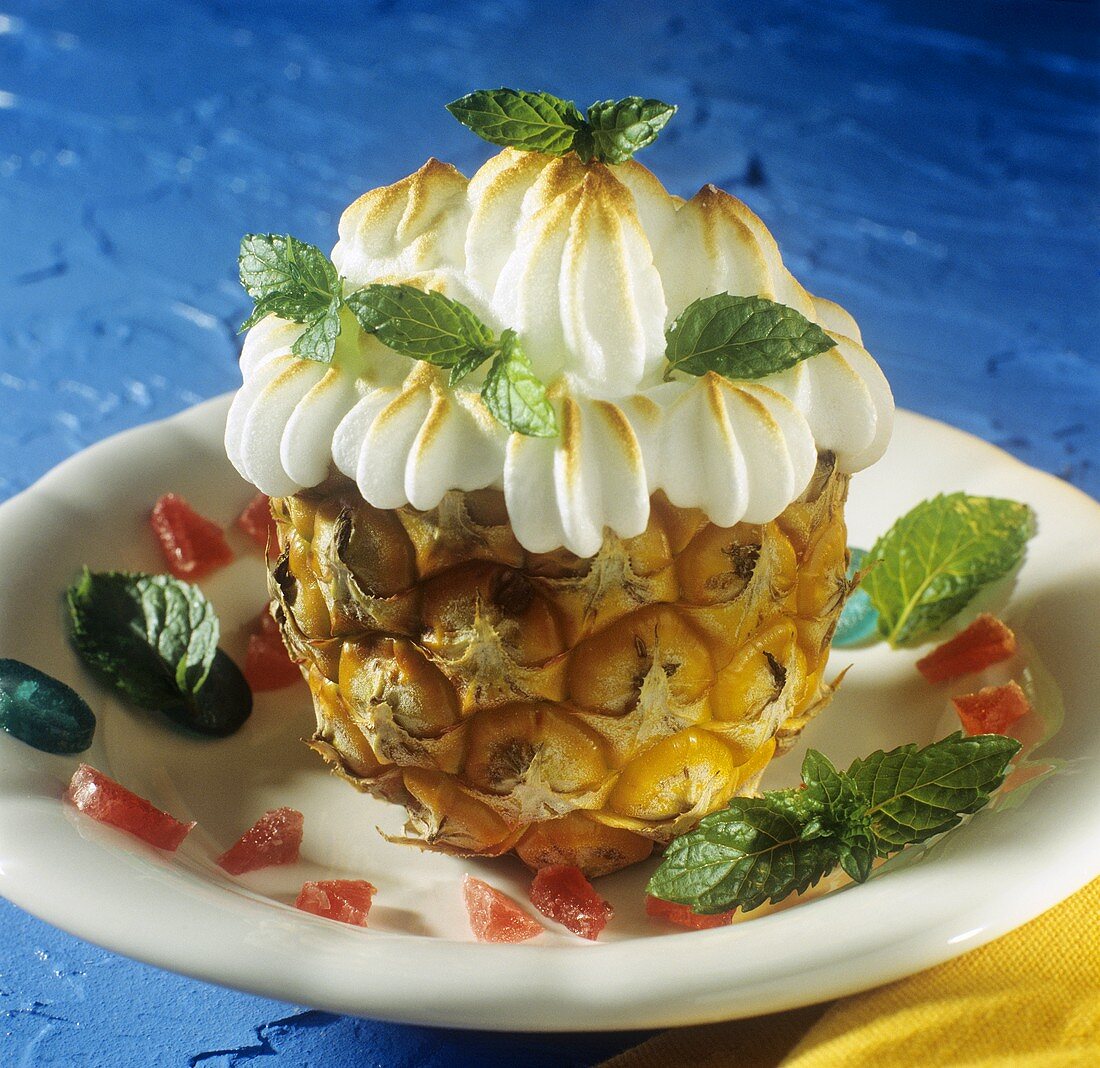 Half a pineapple topped with meringue