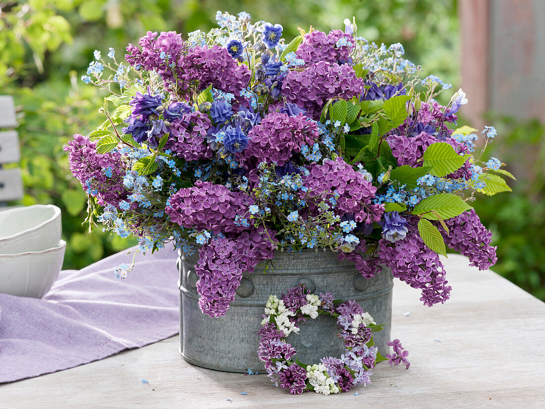 Fragrant spring bouquet from Syringa, Aquilegia