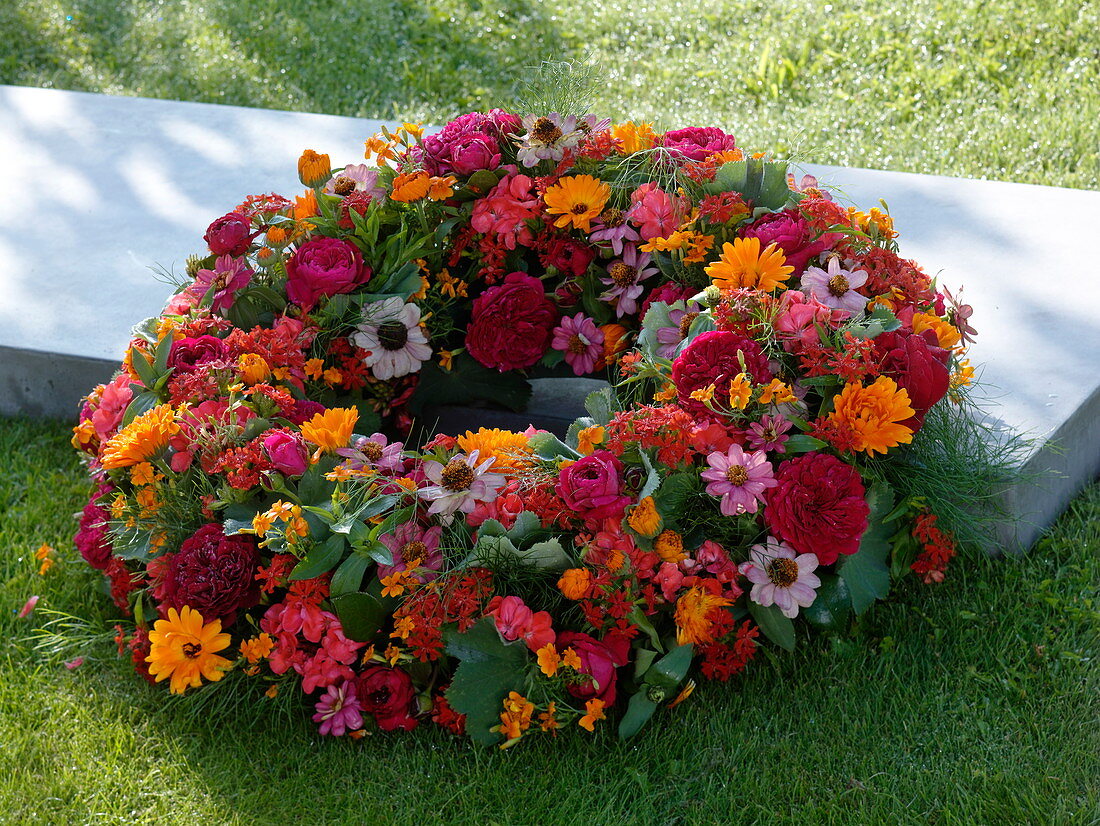 Late summer wreath: Rosa (roses), Zinnia (zinnias), Calendula