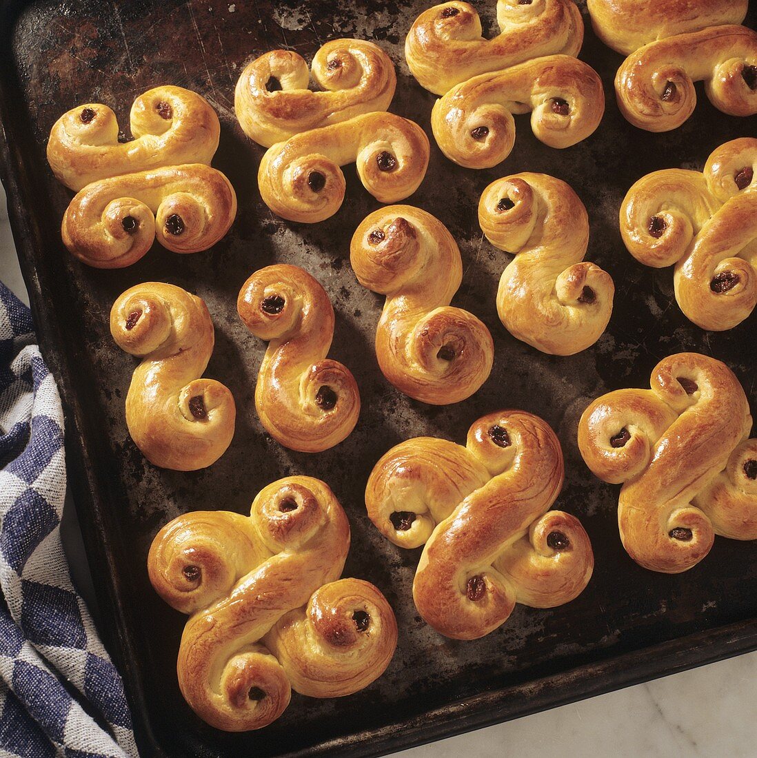 Yeast baking: Swedish 'Lussekatter' on baking tray