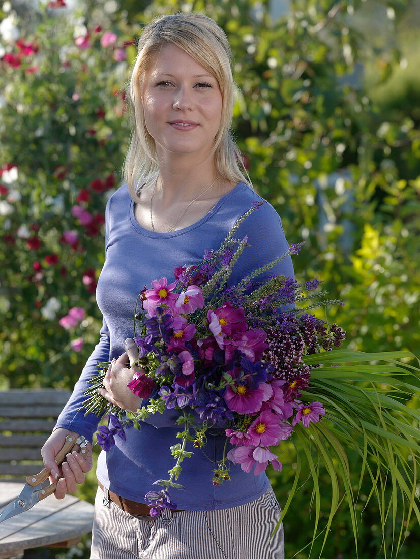 Young woman with freshly cut Cosmos (Jewel Basket)