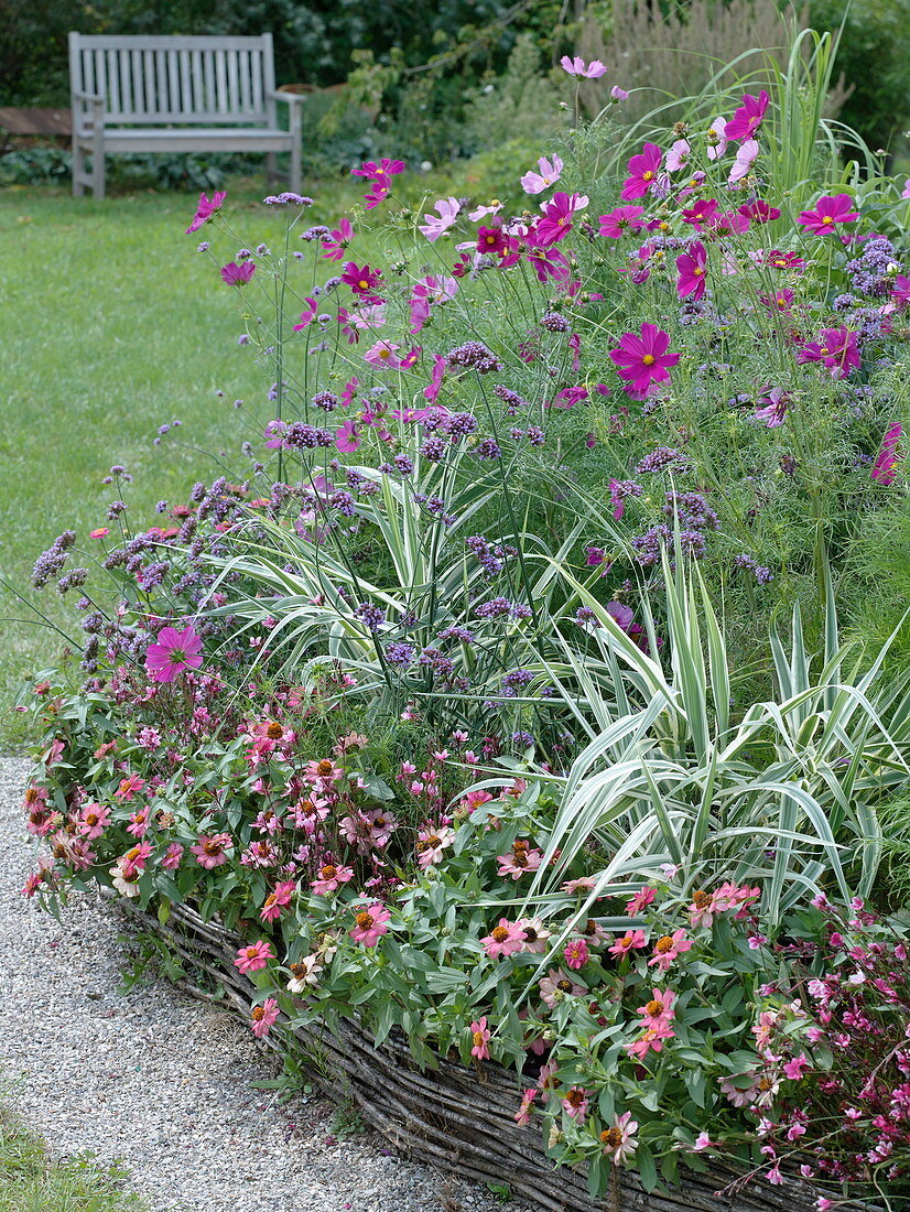 Summer flower bed with willow border