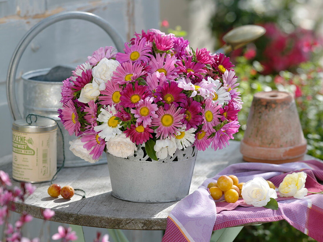 Late summer bouquet of summer asters and roses