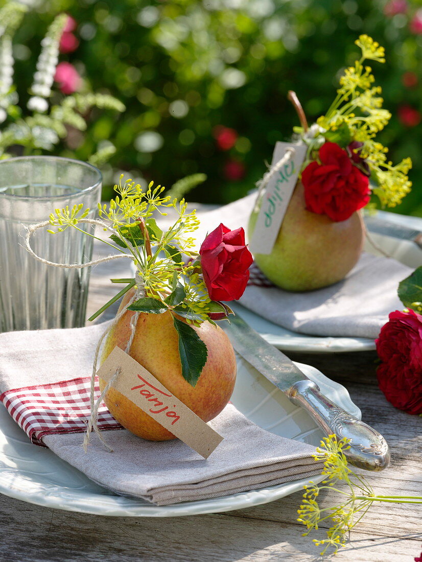 Pear with red rose and fennel flowers as napkin decoration