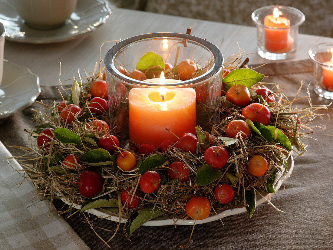 Hay wreath trimmed with ornamental apples