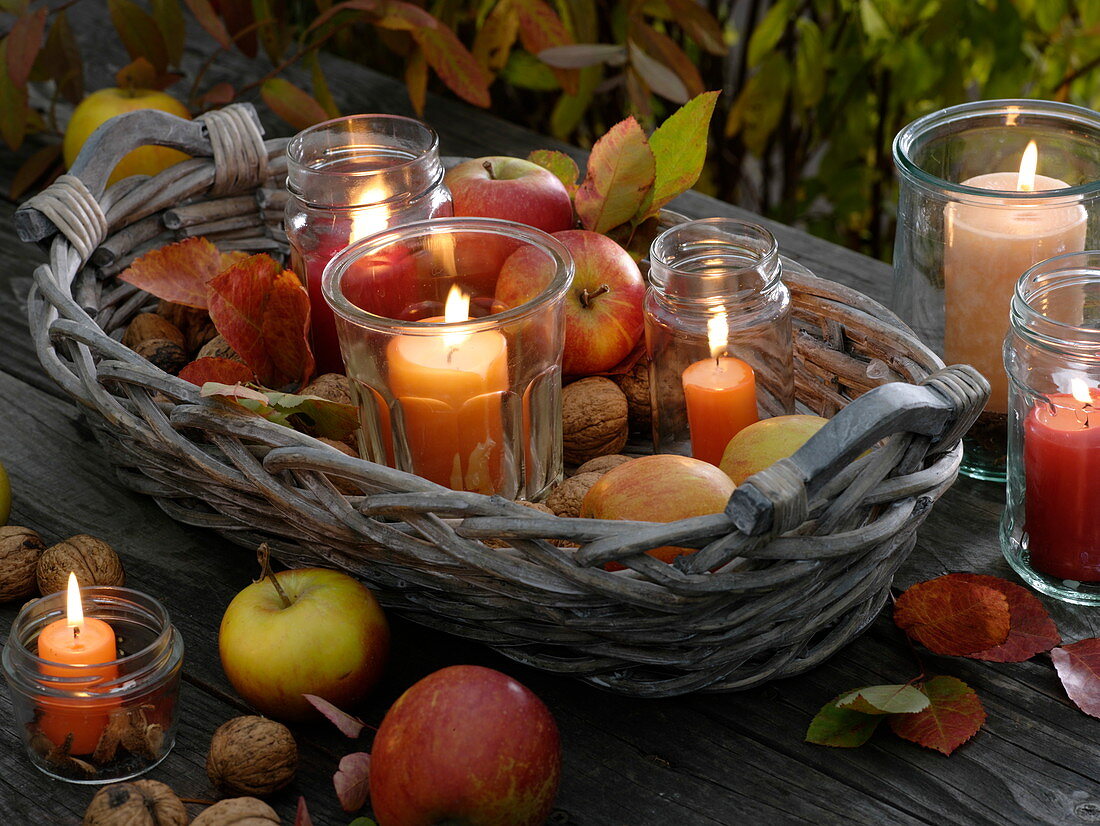 Autumn basket with lanterns and apples