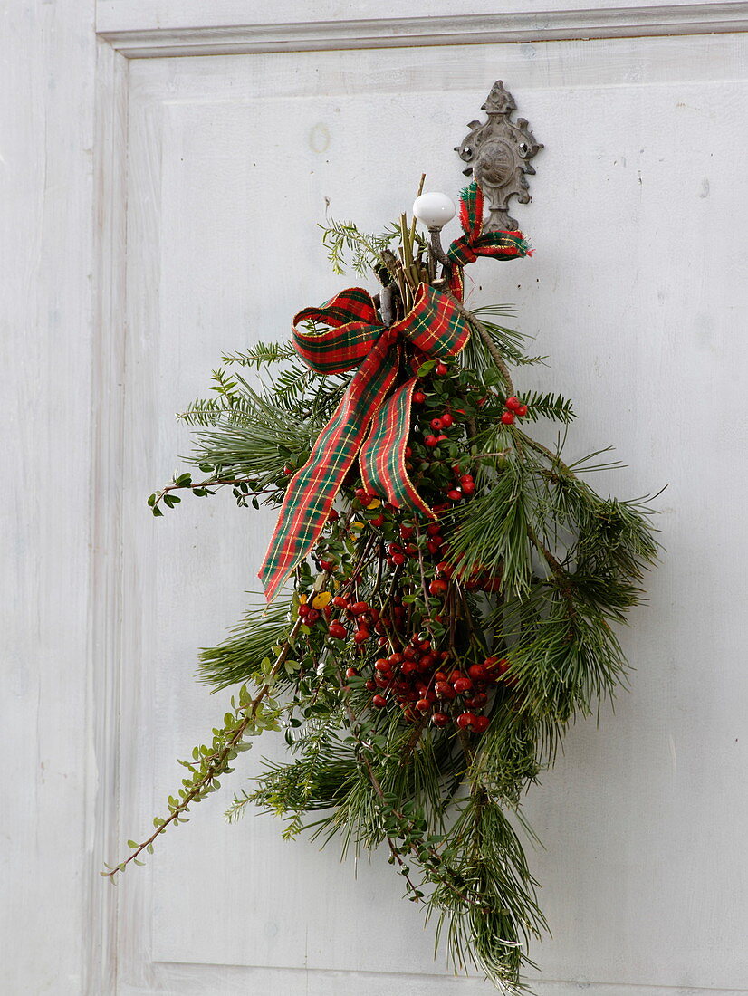 Door decoration: twigs of Pinus (pine), Cotoneaster (dwarf medlar), Tsuga