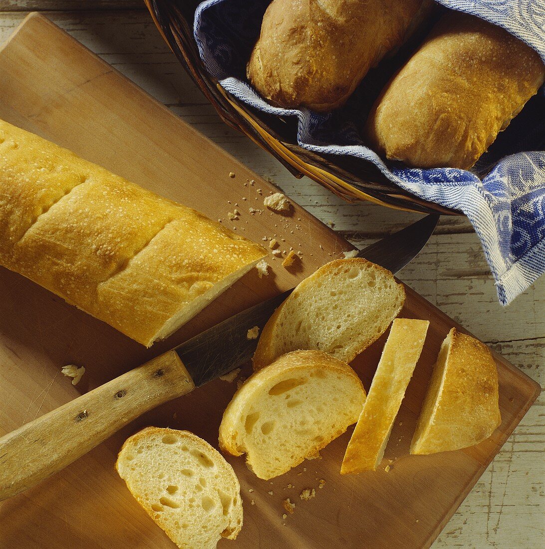 A French bread cut on a wooden board