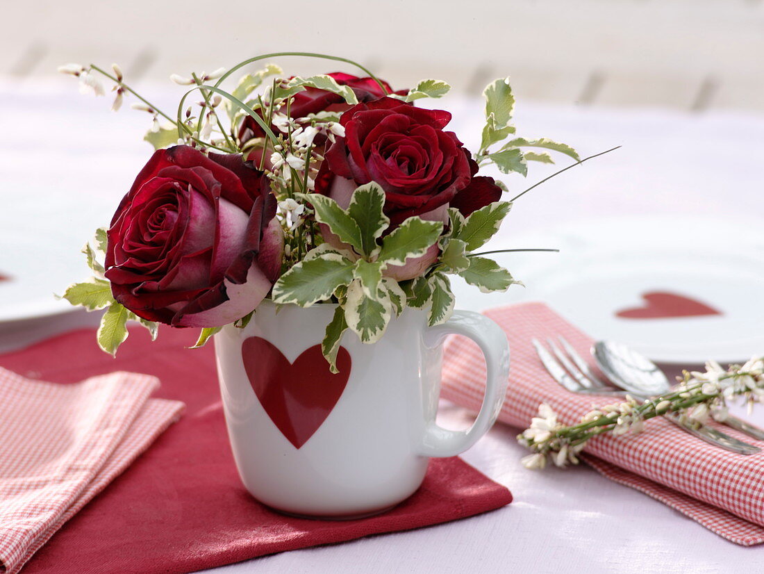 Small bouquet of red rose, Pittosporum and Cytisus