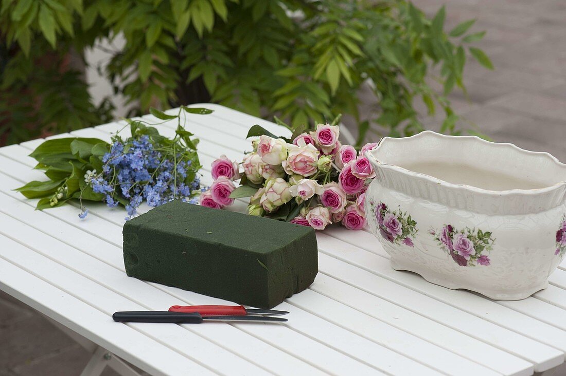 Rose forget-me-not arrangement in rose jardiniere