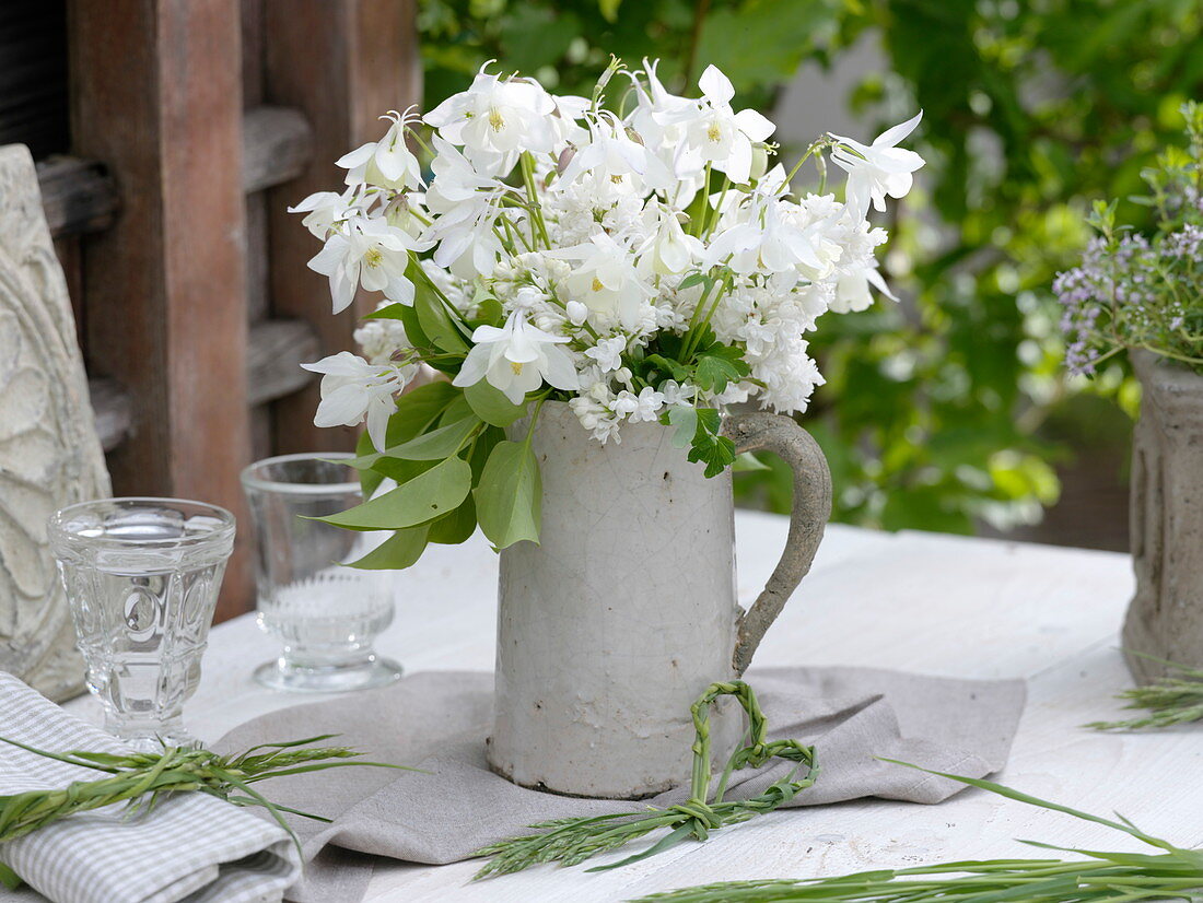 White scented bouquet in pottery jug