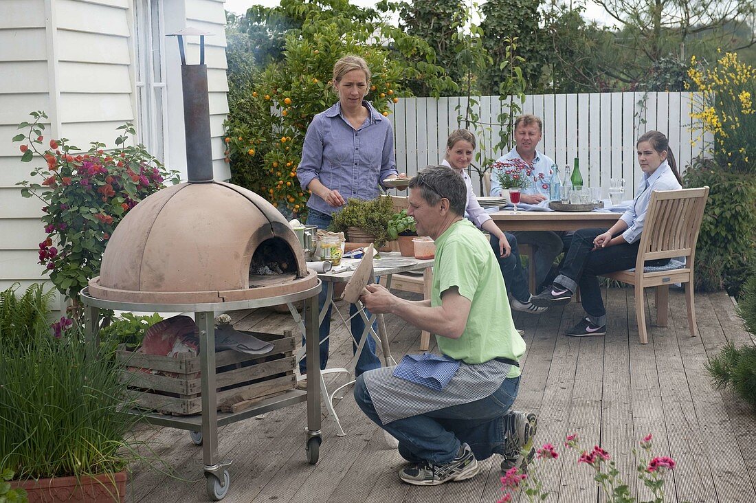 Pizza party on wooden terrace