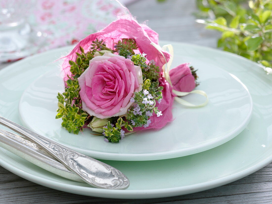 Small bouquet with pink (rose) and lemon thyme (Thymus citriodorus)