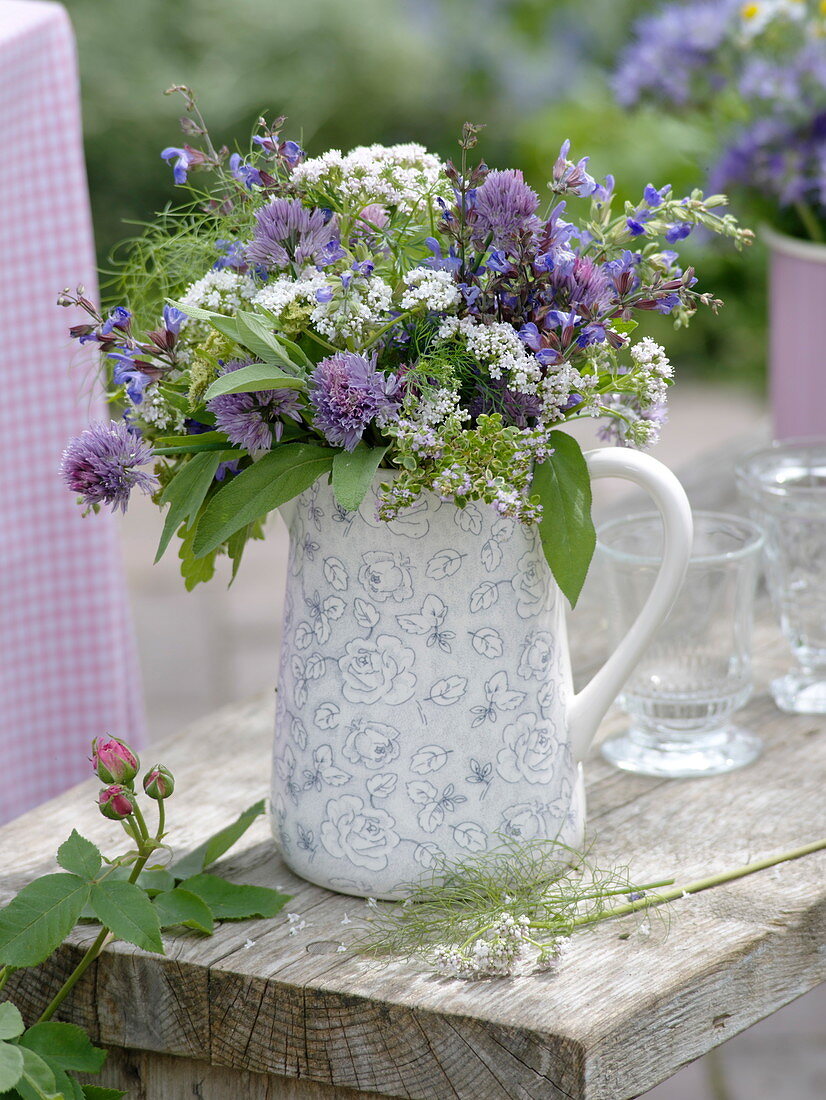 Bouquet of herb flowers in a jug