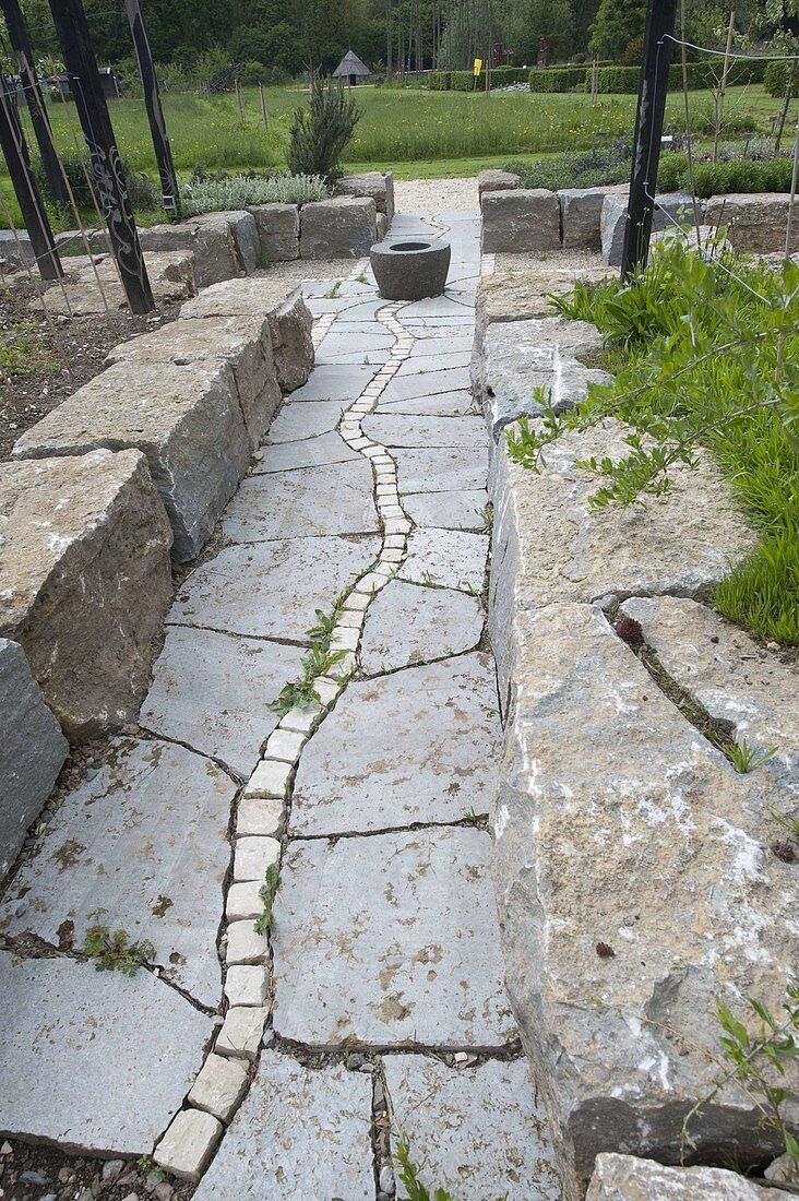 Granite pavement with marble inlay