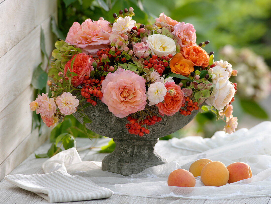 Arrangement in grey bowl with foot