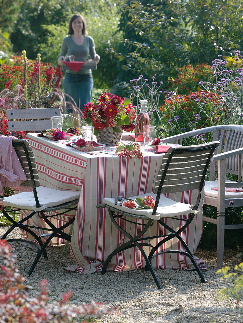 Table decoration with red flowers and berries