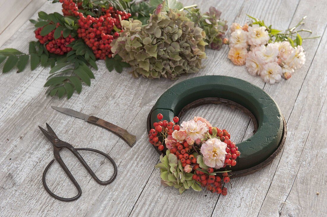 Late summer wreath made from Rosa (roses), Sorbus (rowan berries) (1/2)