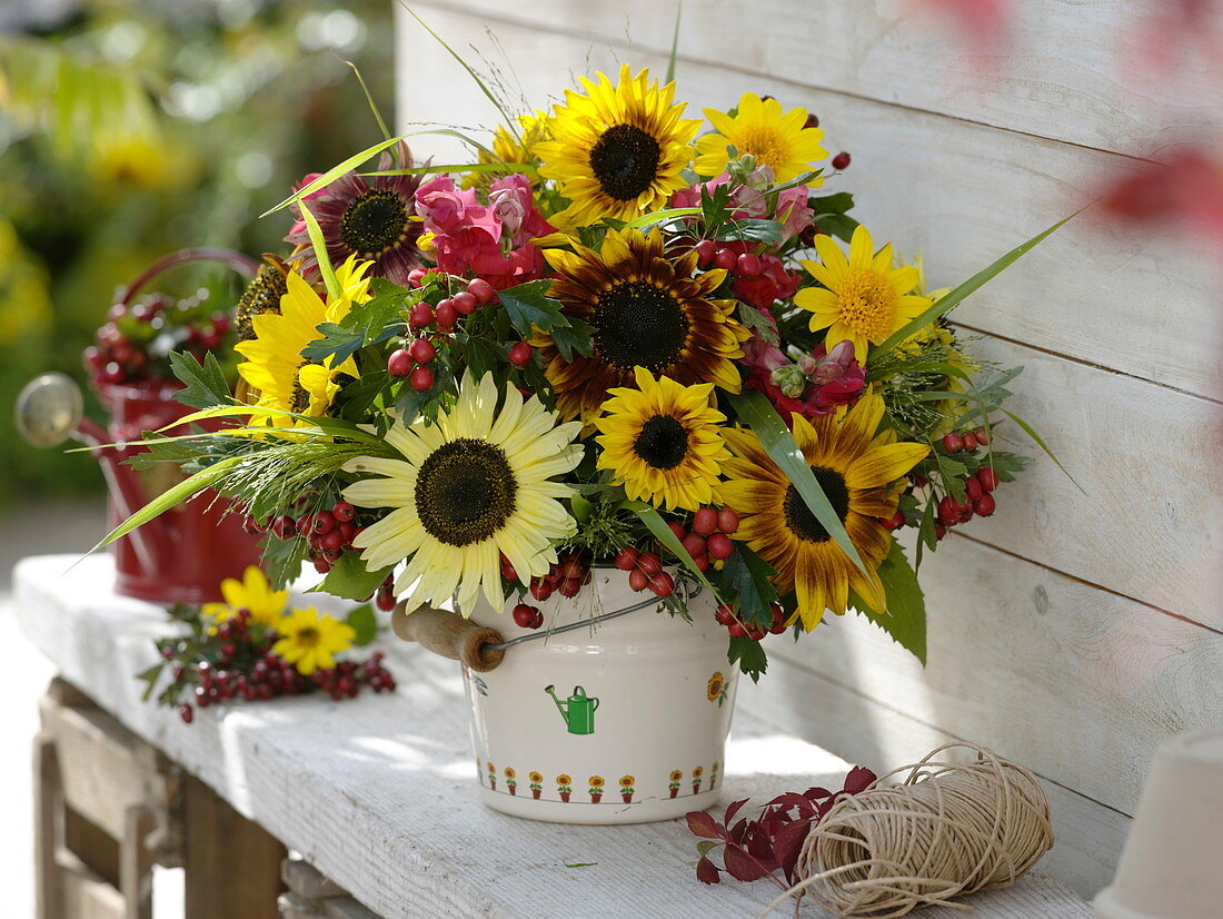 Rural late summer bouquet with Helianthus (sunflowers), Crataegus