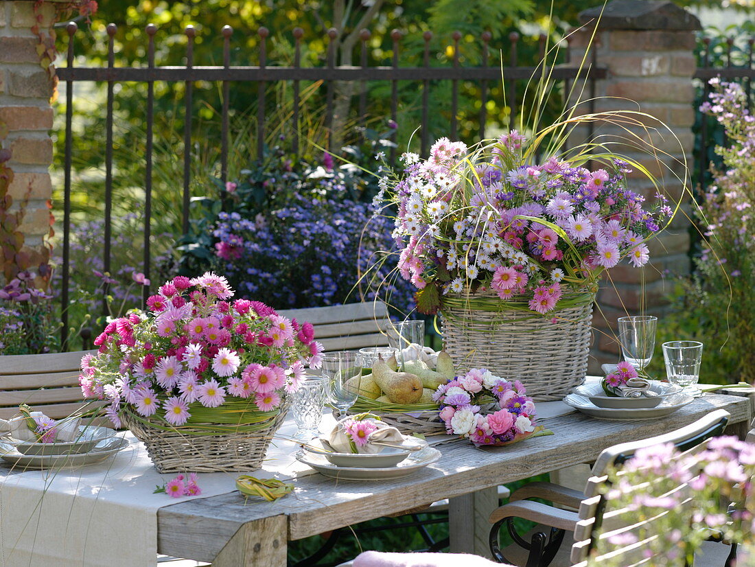 Autumn table decoration with asters and pears