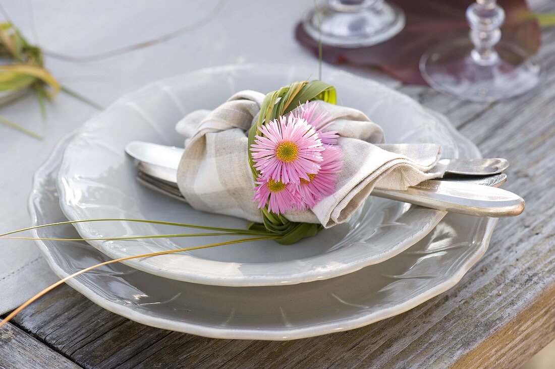 Autumn table decoration with asters and pears