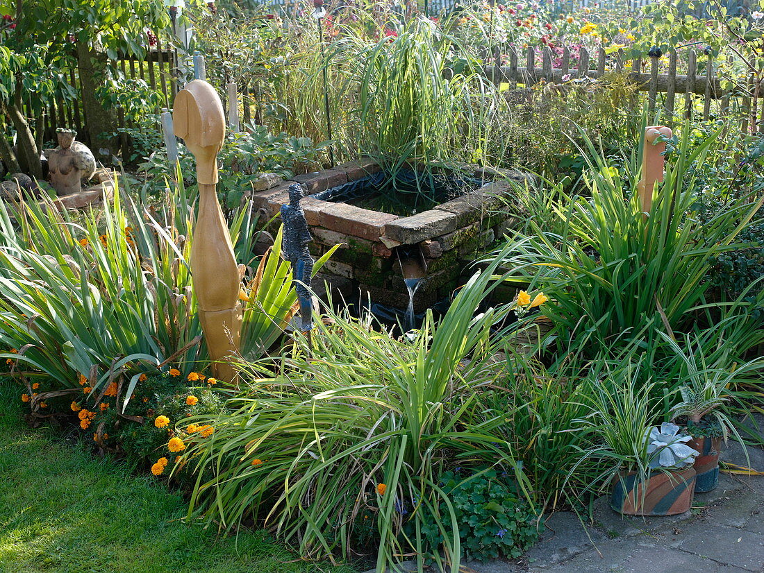 Art garden, water basin and perennials