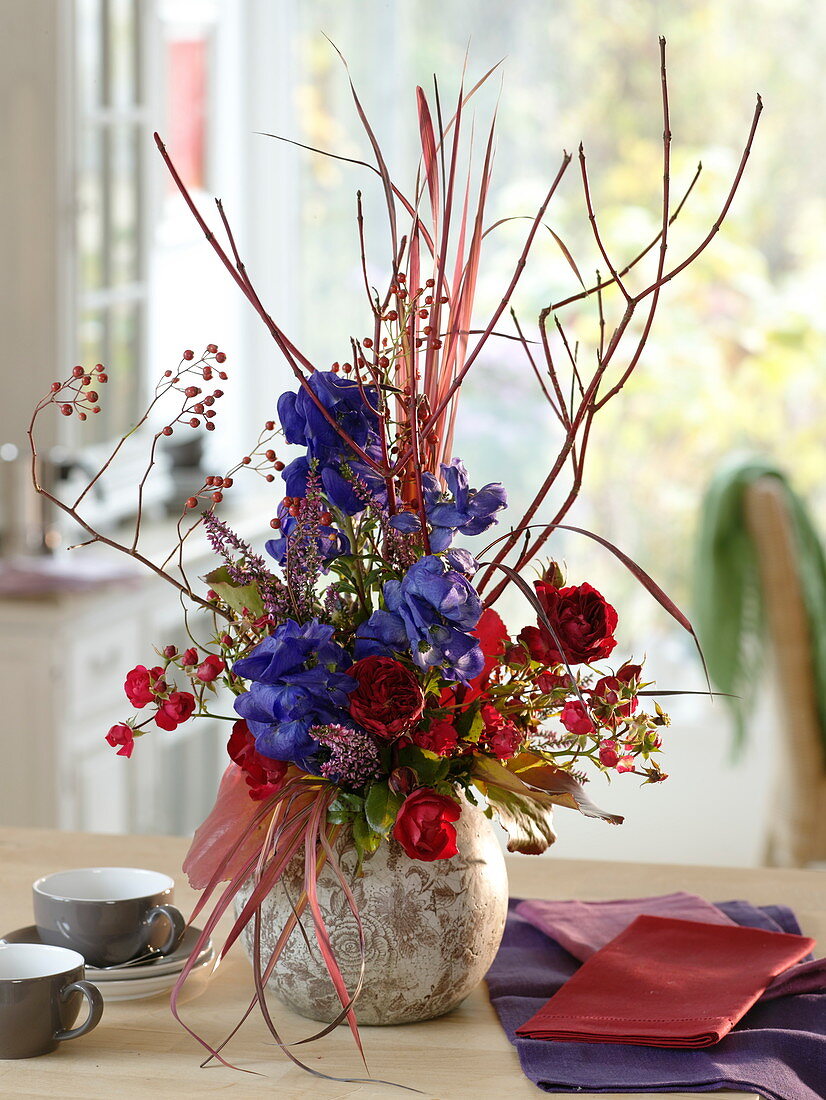 Autumnal arrangement with branches of Cornus (dogwood), Aconitum