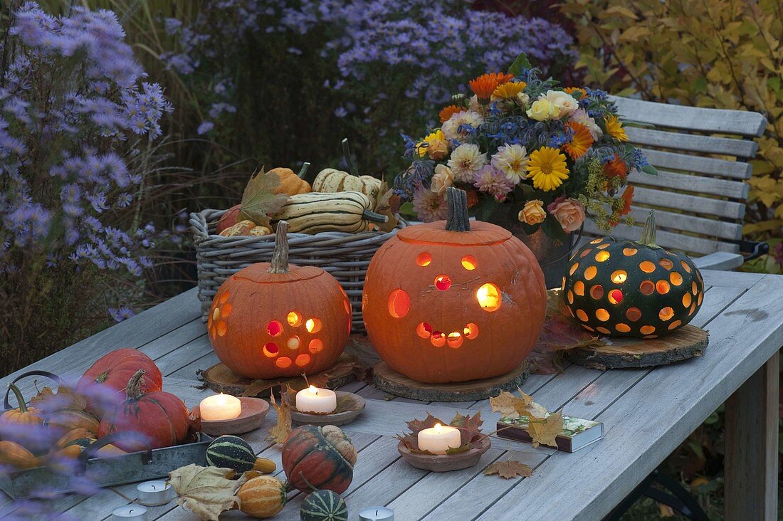 Autumn arrangement with pumpkins on wooden table