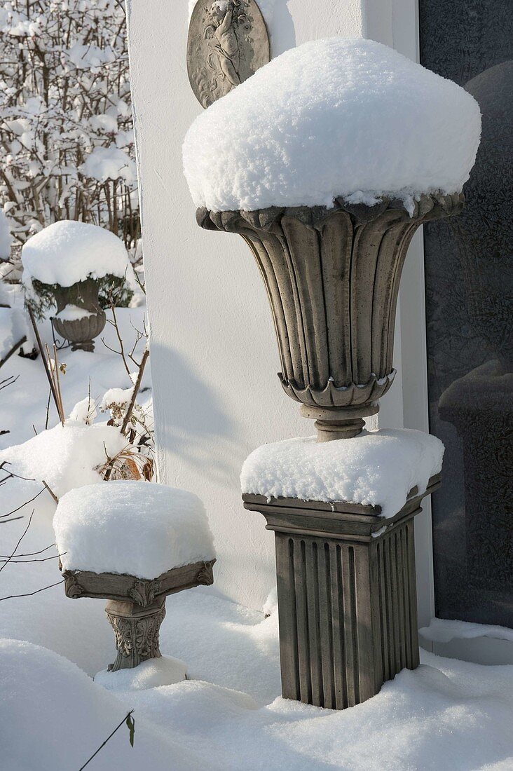 Snowy amphora on column