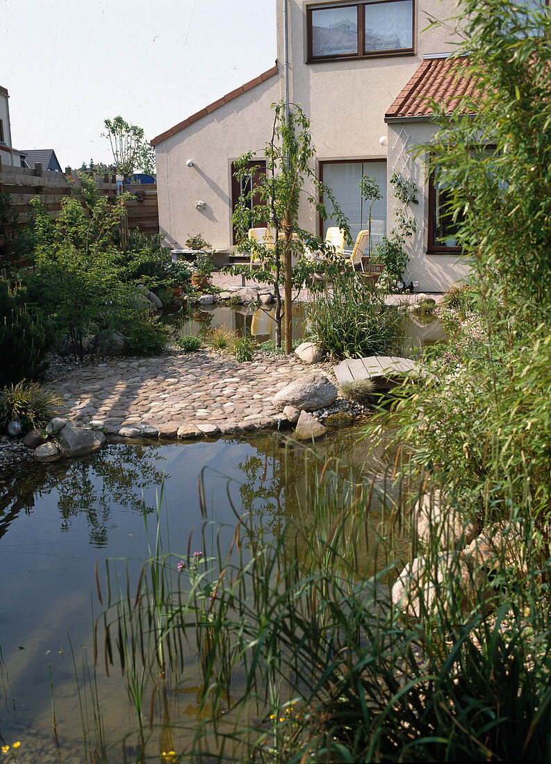 Garden view with terrace and pond