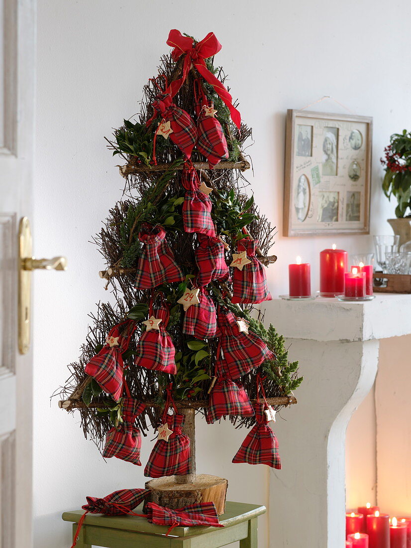 Stylised Christmas tree of birch brushwood as Advent calendar